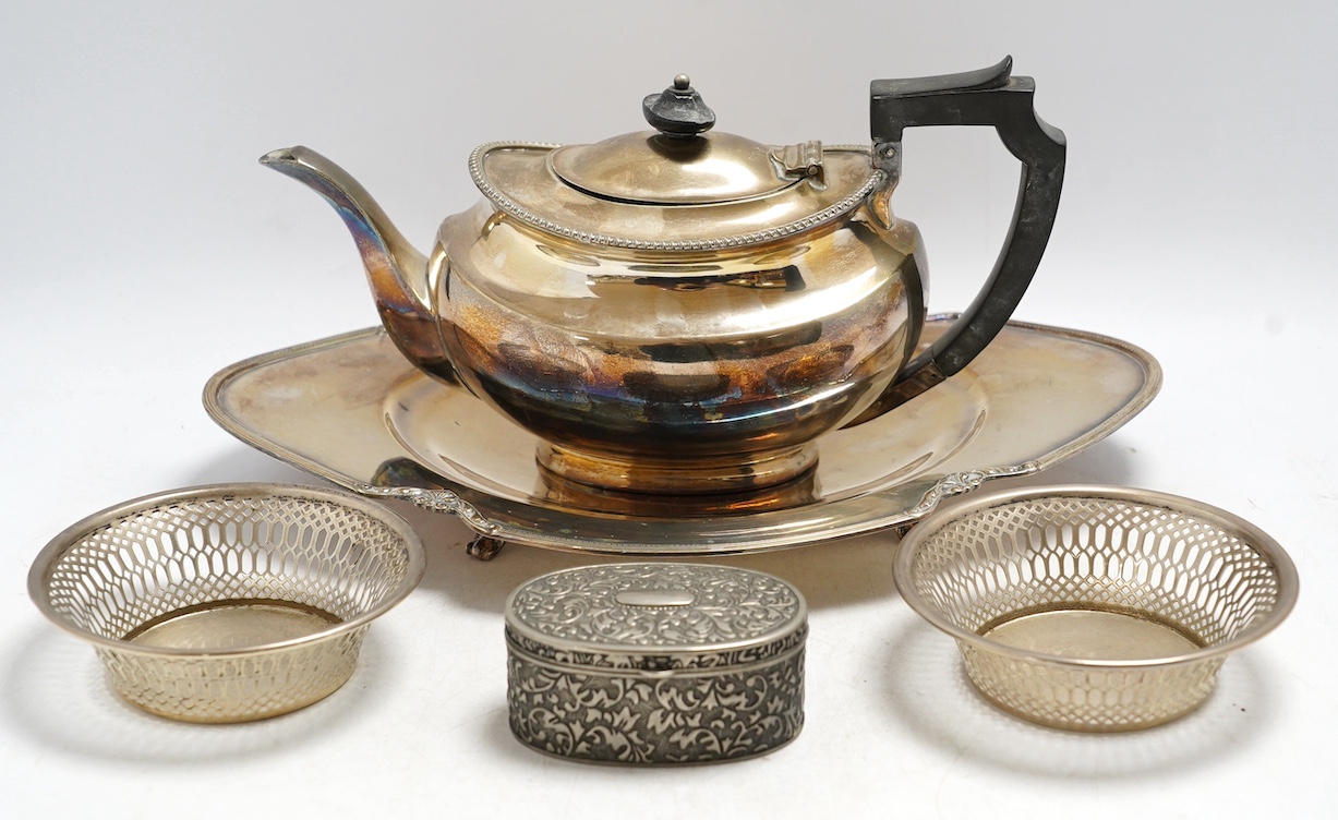 A pair of George V pierced silver bonbon dishes, Birmingham 1928, 11.8cm, a modern silver coin dish and a small group of silver plated items including a teapot and two sauceboats, etc. Condition - fair